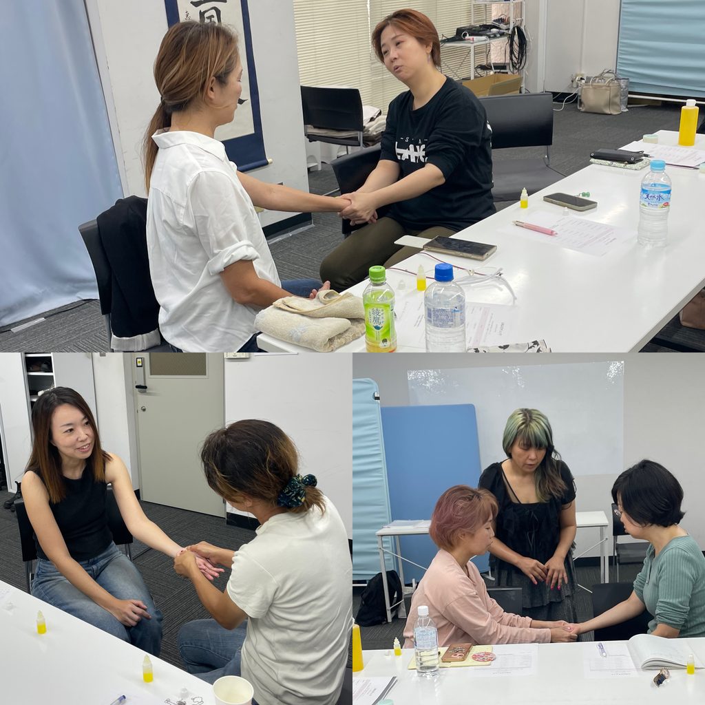 関東リアル体験会で、参加者同士が手や腕にケアをし合う様子